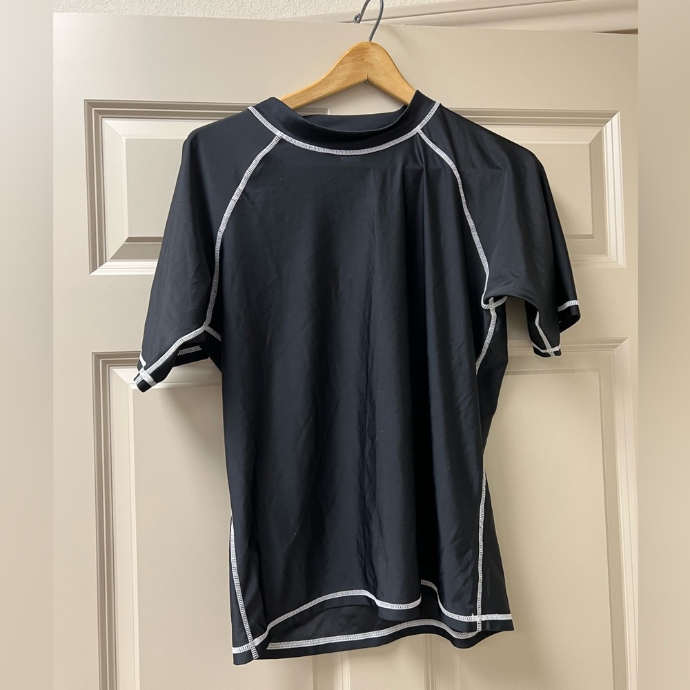 Women’s size 1X Beach Belle black short sleeve swim shirt.